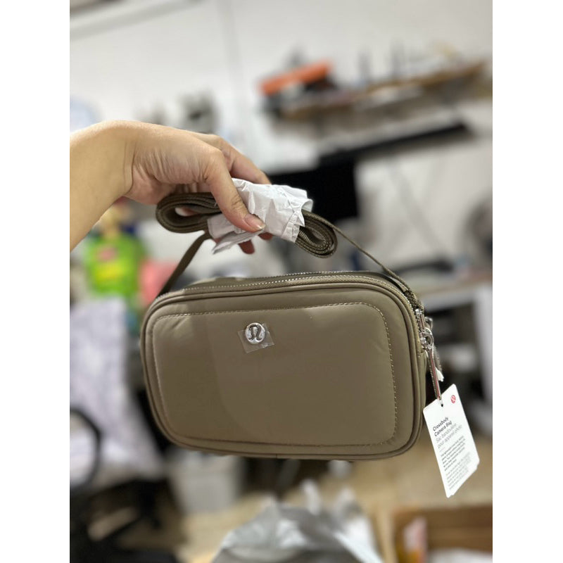 ORIG & IMPORTED Lululemon Crossbody Camera Bag 2L in Brown