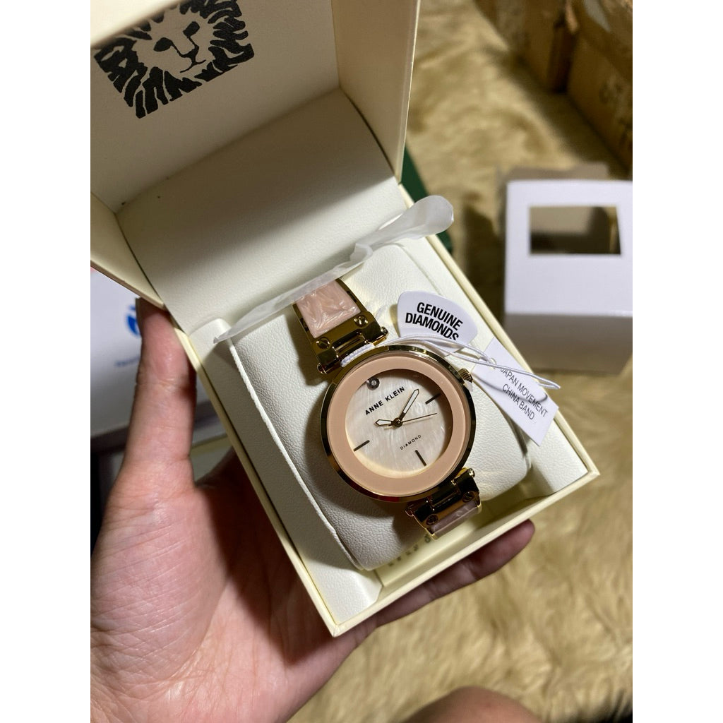 AK Klein AK/2512LPGB Diamond-Accented Gold-Tone and Blush Pink White Marbleized Bangle Watch