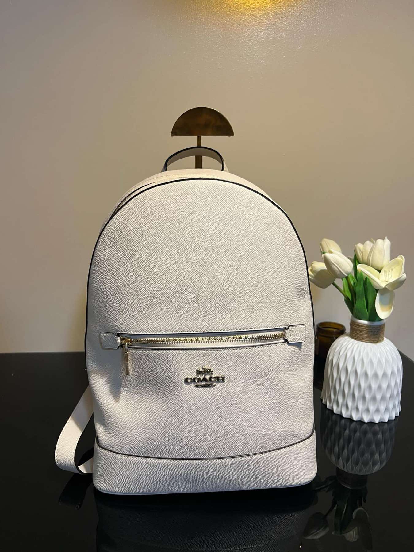 coach backpack kenley In Signature Canvas Signature coated canvas and crossgrain leather Inside zip cell phone and multifunction pockets Zip closure fabric lining Top handle with 3 1/4 drop Outside zip pocket Adjustable shoulder straps 10 (L) x 14 (H) x 5 1/2 (W) Style No Tech Wallet + Kenley Backpack
