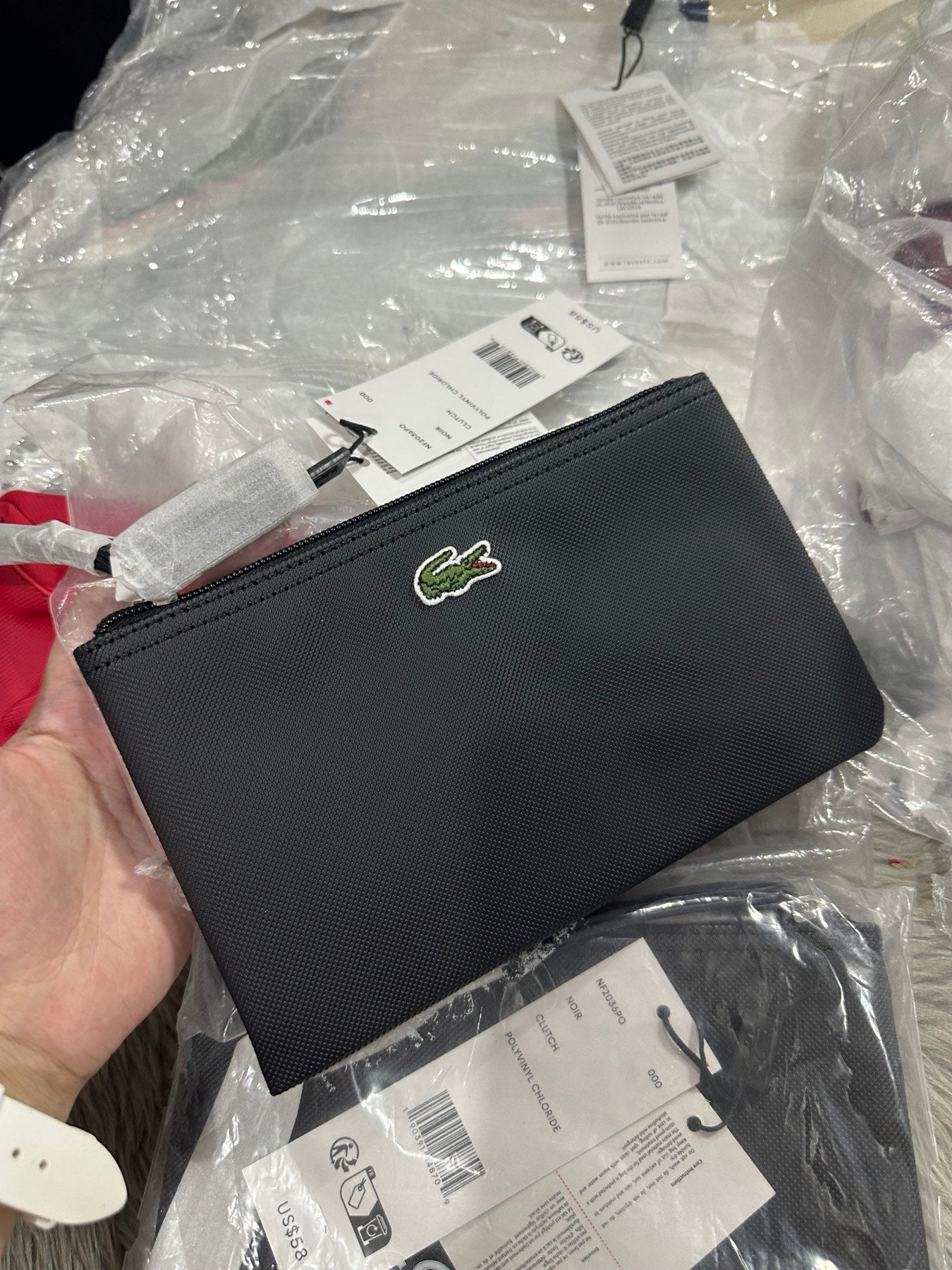 Clutch lacoste best sale