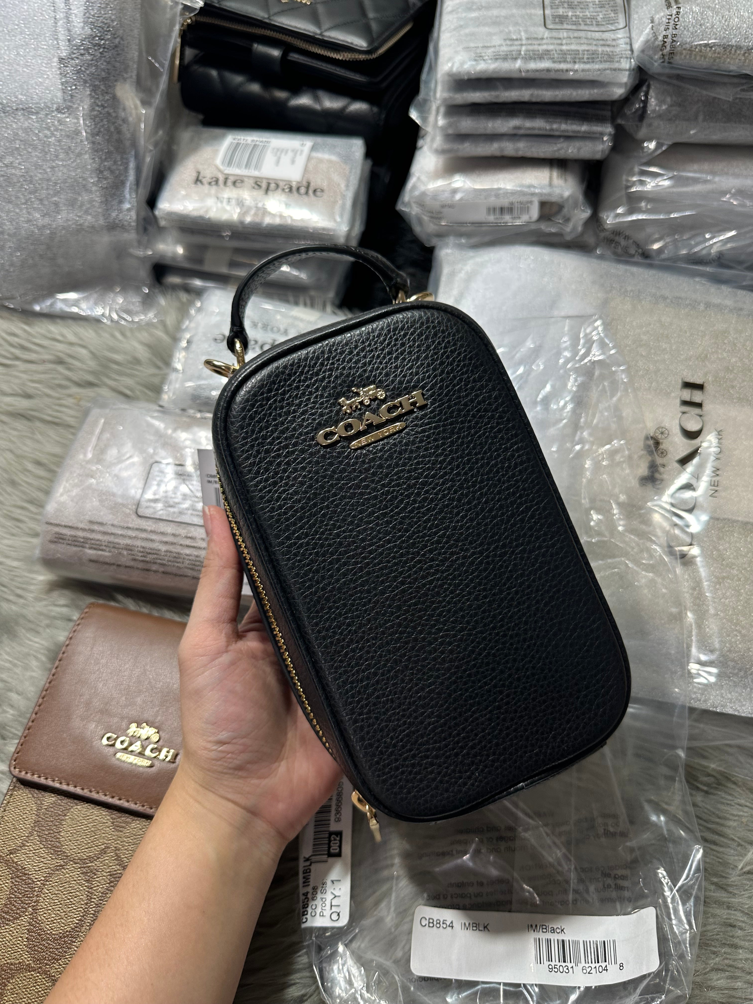 Store Coach phone crossbody