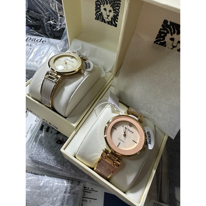 AK Klein Women's AK/2512IVGB Diamond-Accented Dial Gold Tone Ivory White Bangle Watch
