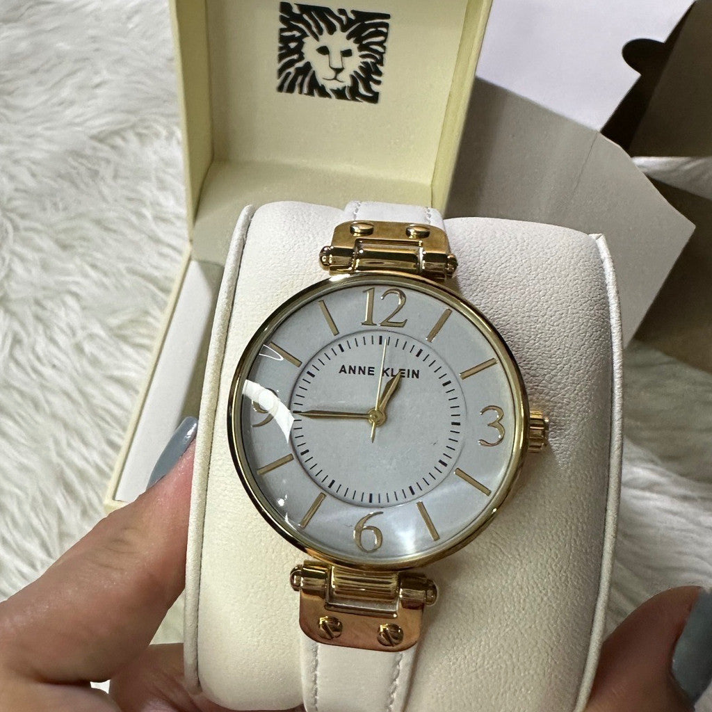ORIG & IMPORTED AK Klein Women's 10-9168WTWT Gold-Tone and White Leather Strap Watch