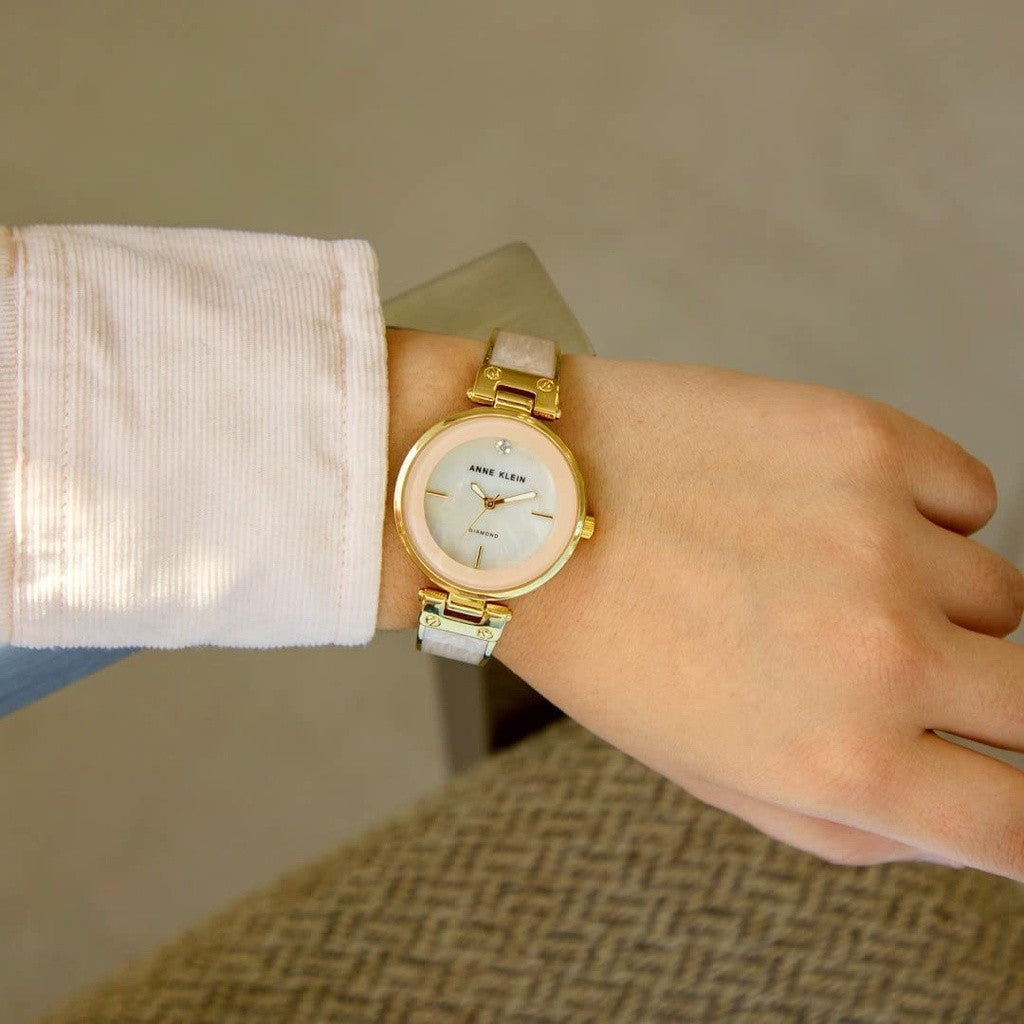 AK Klein AK/2512LPGB Diamond-Accented Gold-Tone and Blush Pink White Marbleized Bangle Watch