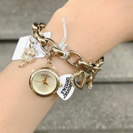 NO BOX! AK Klein Women's Premium Crystal Accented Gold-Tone Charm Bracelet Watch 10/7604CHRM