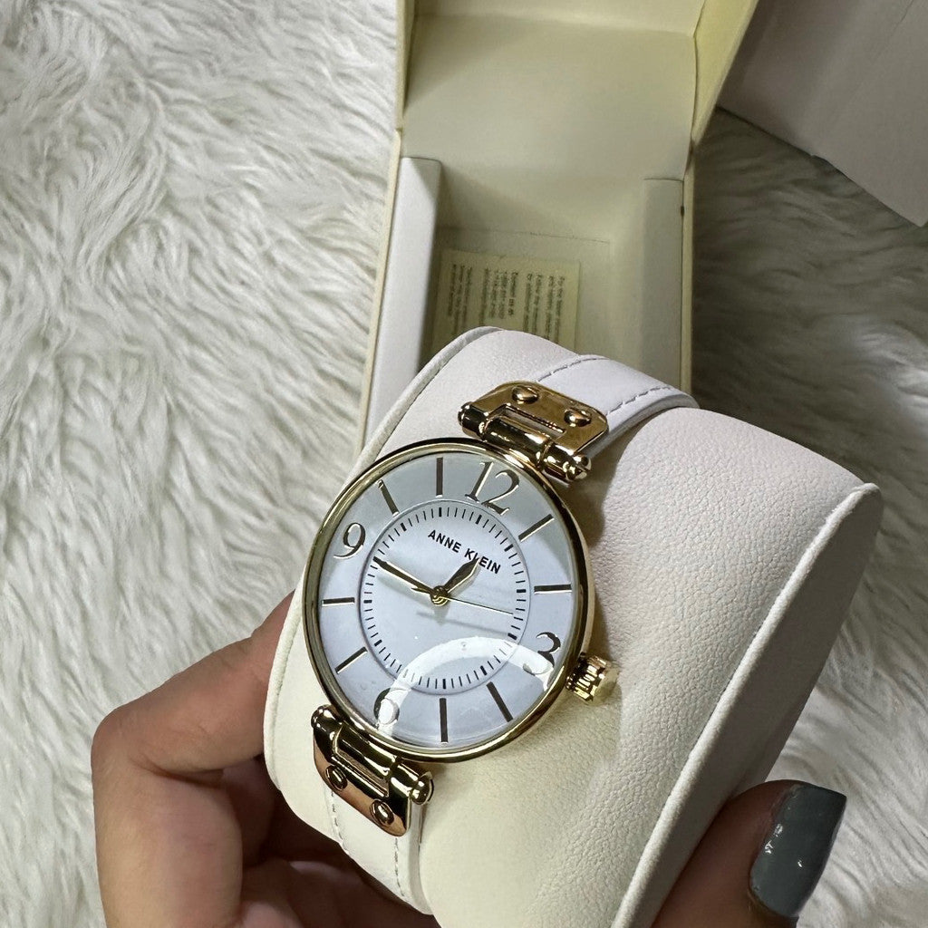 ORIG & IMPORTED AK Klein Women's 10-9168WTWT Gold-Tone and White Leather Strap Watch