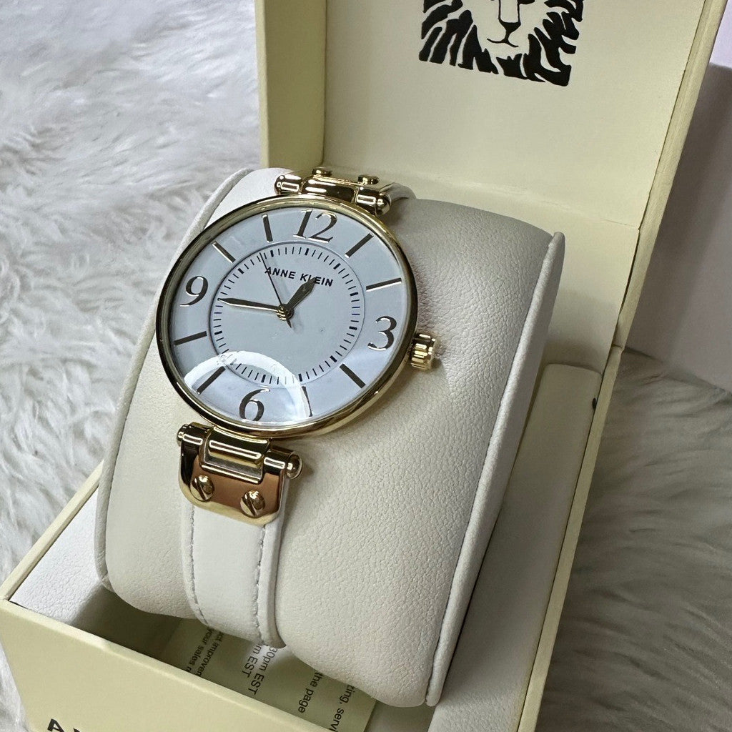 ORIG & IMPORTED AK Klein Women's 10-9168WTWT Gold-Tone and White Leather Strap Watch