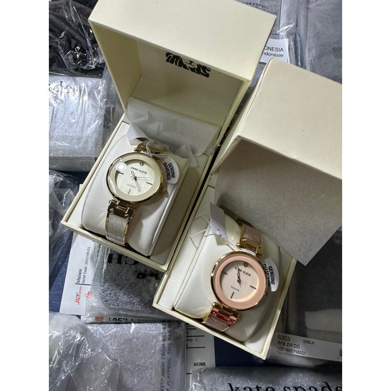 AK Klein AK/2512LPGB Diamond-Accented Gold-Tone and Blush Pink White Marbleized Bangle Watch