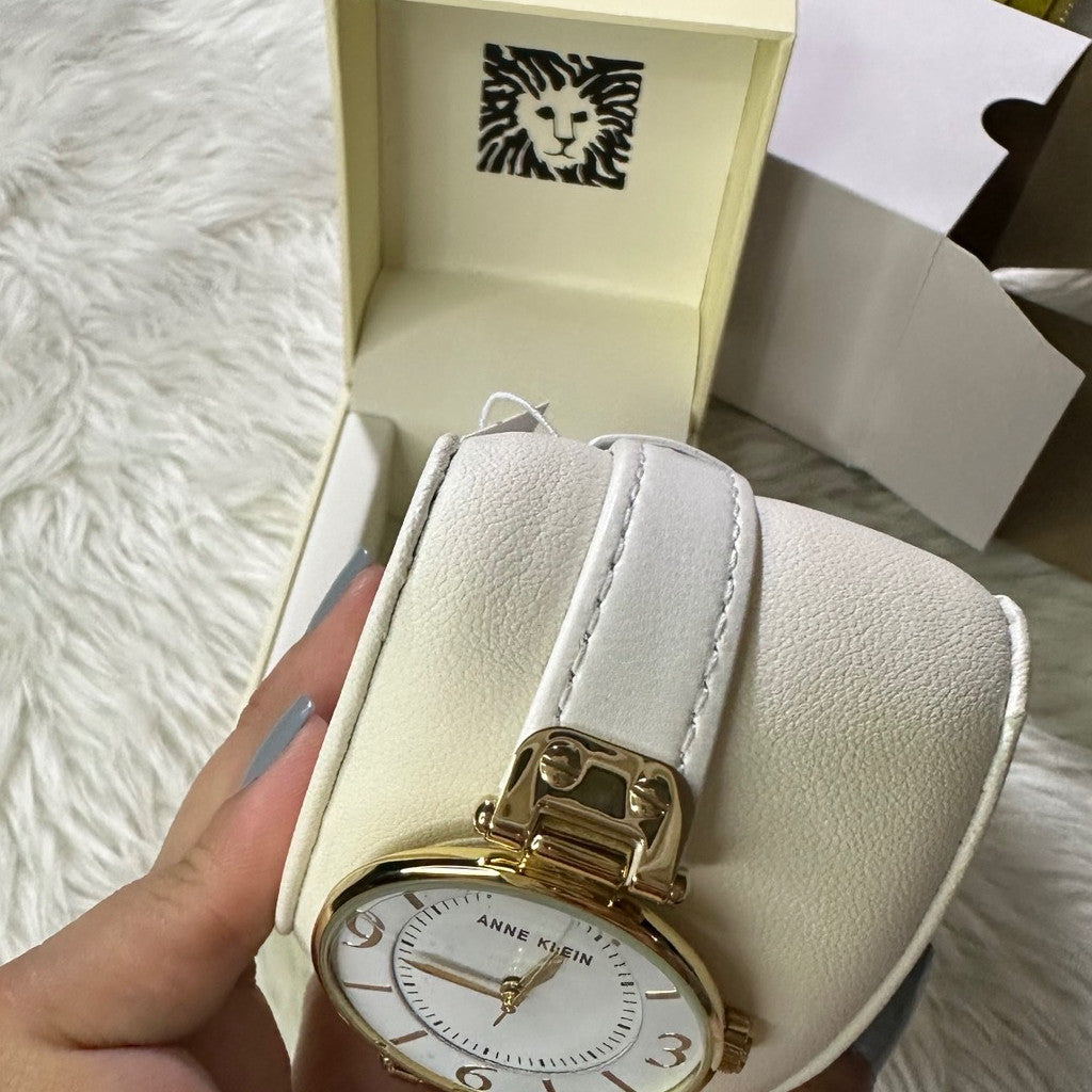 ORIG & IMPORTED AK Klein Women's 10-9168WTWT Gold-Tone and White Leather Strap Watch