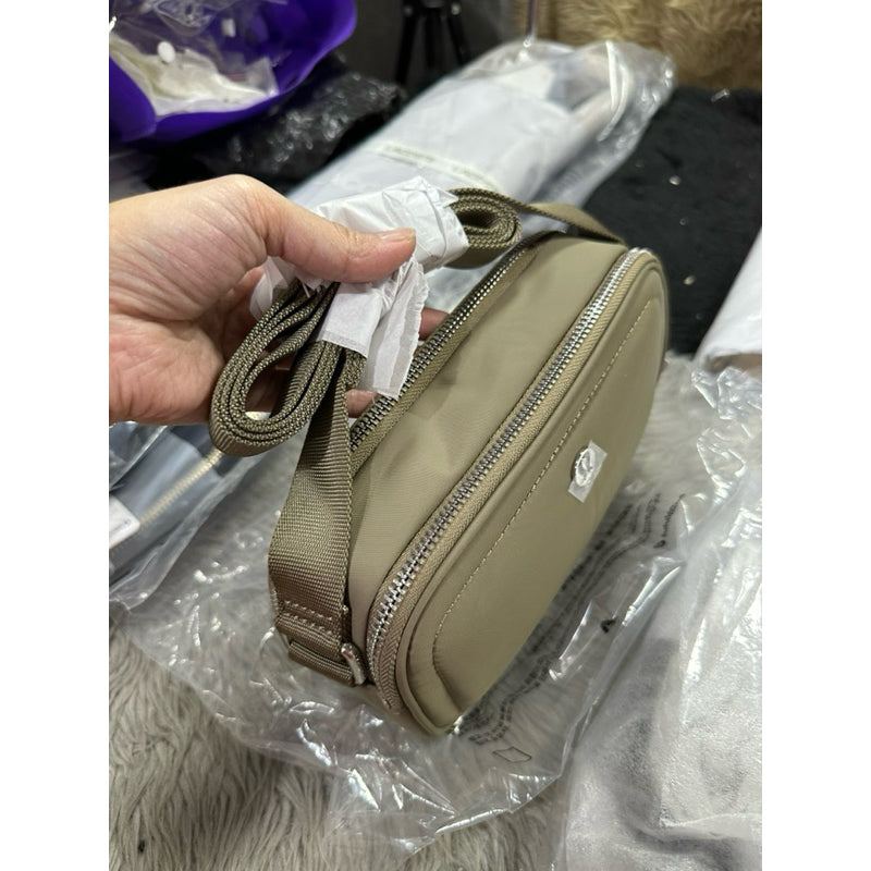 ORIG & IMPORTED Lululemon Crossbody Camera Bag 2L in Brown