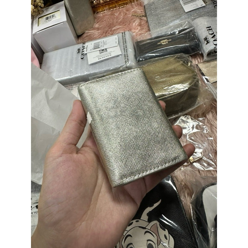ORIG & IMPORTED WITH FLAW MJ The Snapshot Mini Trifold Wallet in Metallic Silver