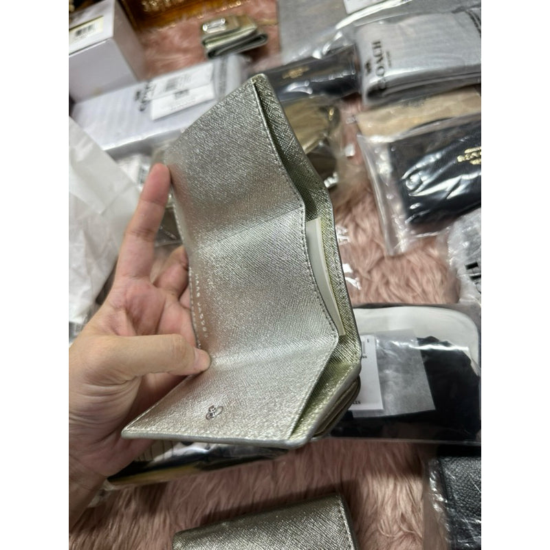 ORIG & IMPORTED WITH FLAW MJ The Snapshot Mini Trifold Wallet in Metallic Silver