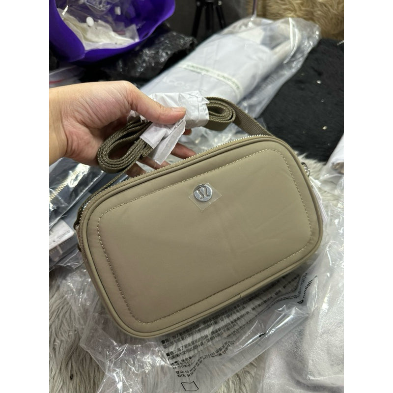 ORIG & IMPORTED Lululemon Crossbody Camera Bag 2L in Brown