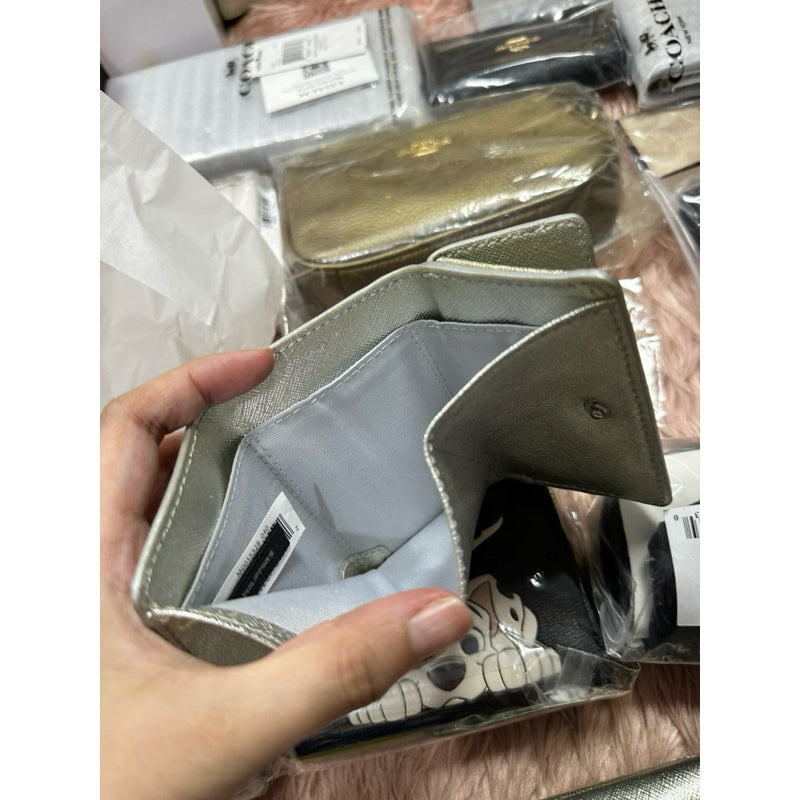 ORIG & IMPORTED WITH FLAW MJ The Snapshot Mini Trifold Wallet in Metallic Silver