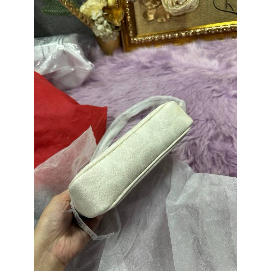 ORIG & IMPORTED CCH Nolita 19 In Signature Canvas Glacier White Small Kilikili Bag