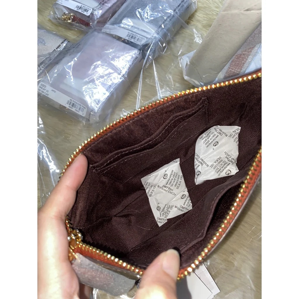 ORIG & IMPORTED CCH Nolita 19 In Colorblock Signature Canvas Kilikili Bag in Khaki Brown