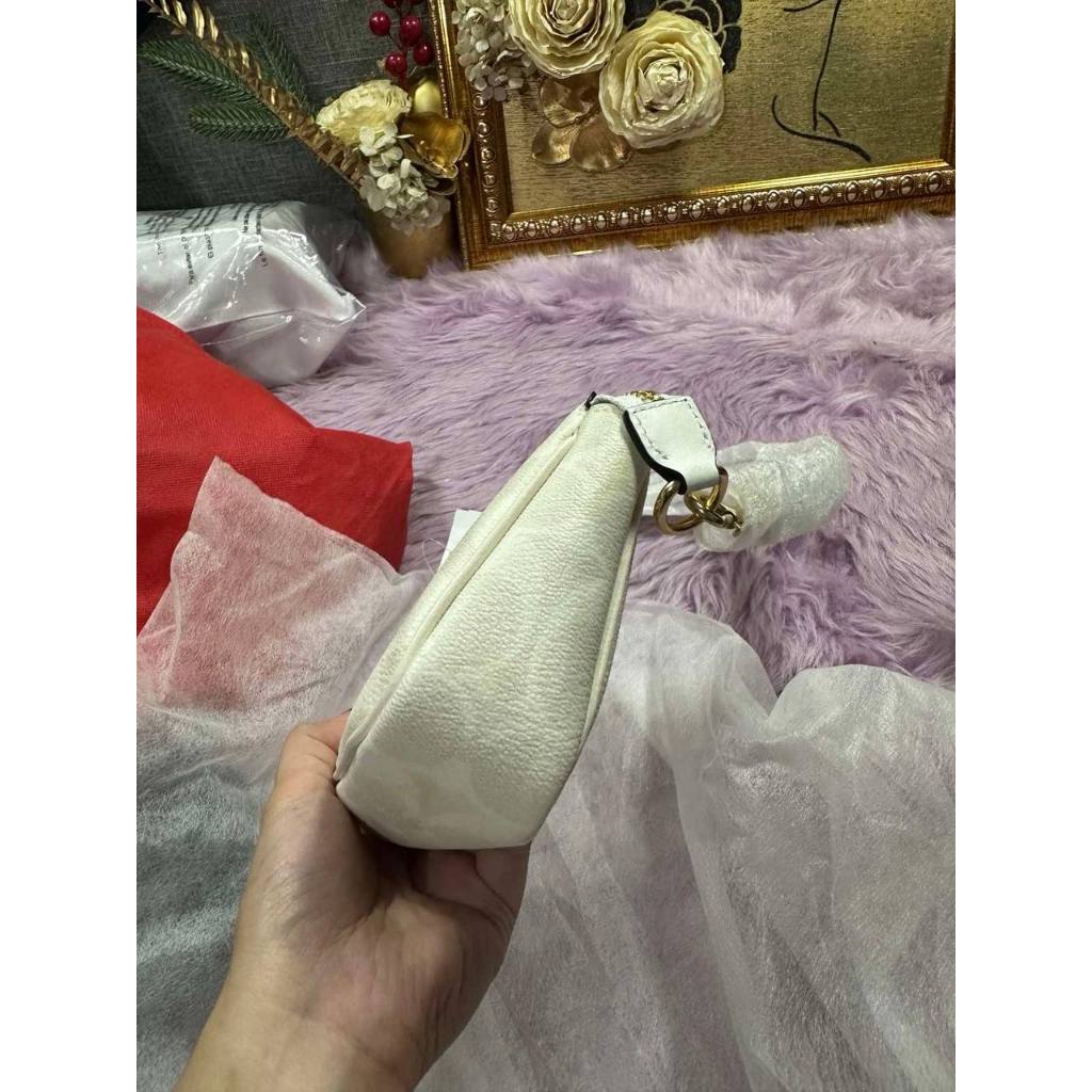 ORIG & IMPORTED CCH Nolita 19 In Signature Canvas Glacier White Small Kilikili Bag
