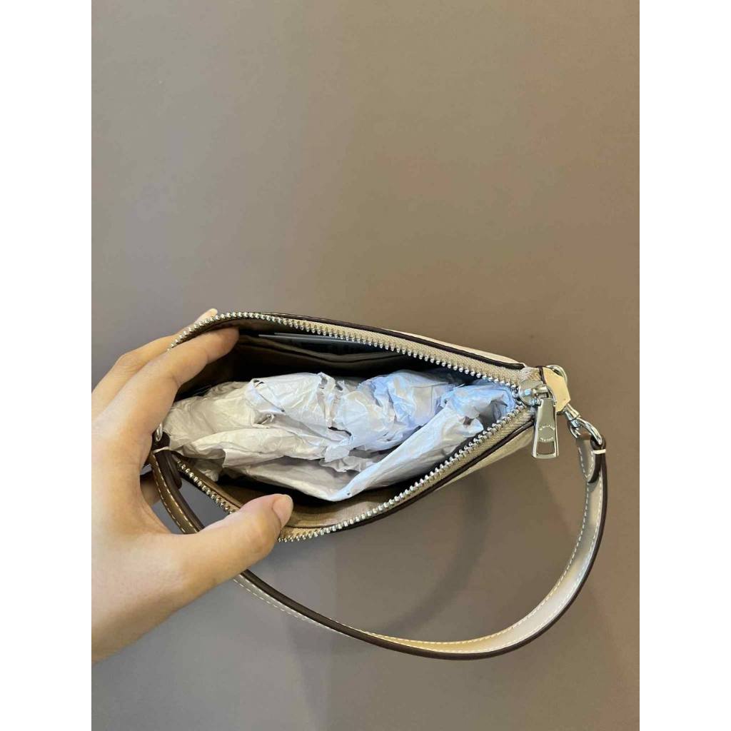 ORIG & IMPORTED CCH Nolita 19 In Signature Canvas Sand/Taupe Small Kilikili Bag