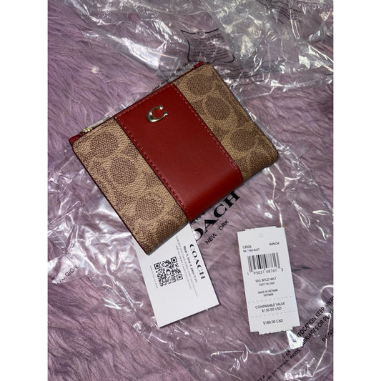 ORIG & IMPORTED Retail CCH Bifold Snap Brown Wallet In Signature Canvas