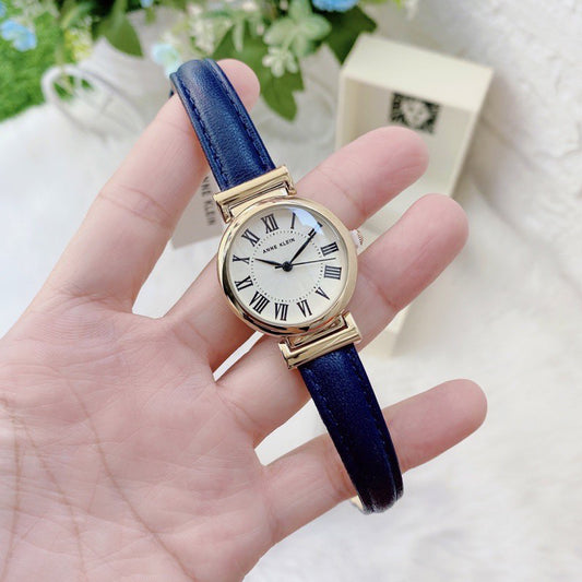 ORIG & IMPORTED AK Klein AK/2246CRNV Gold-Tone and Navy Blue Leather Strap Watch