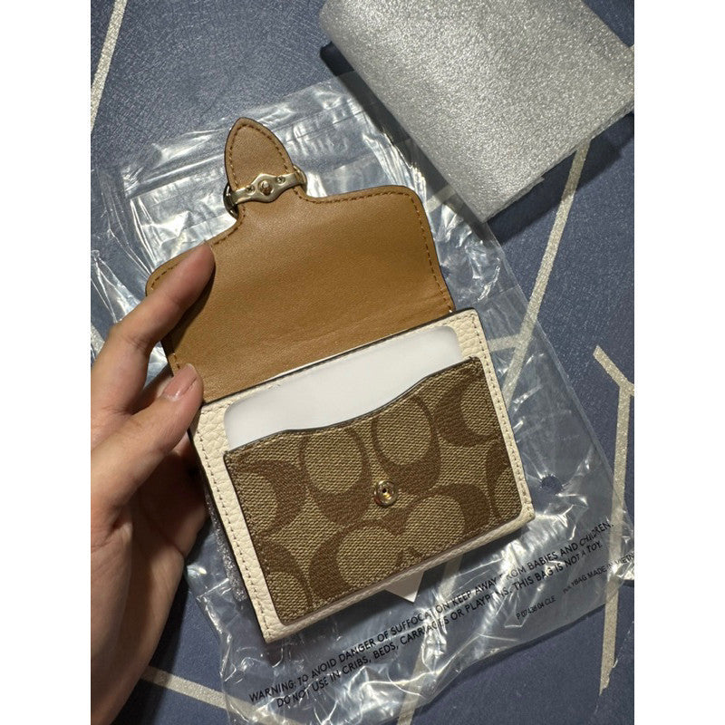 ORIG & IMPORTED C0@CH Georgie Small Wallet In Blocked Signature Canvas
