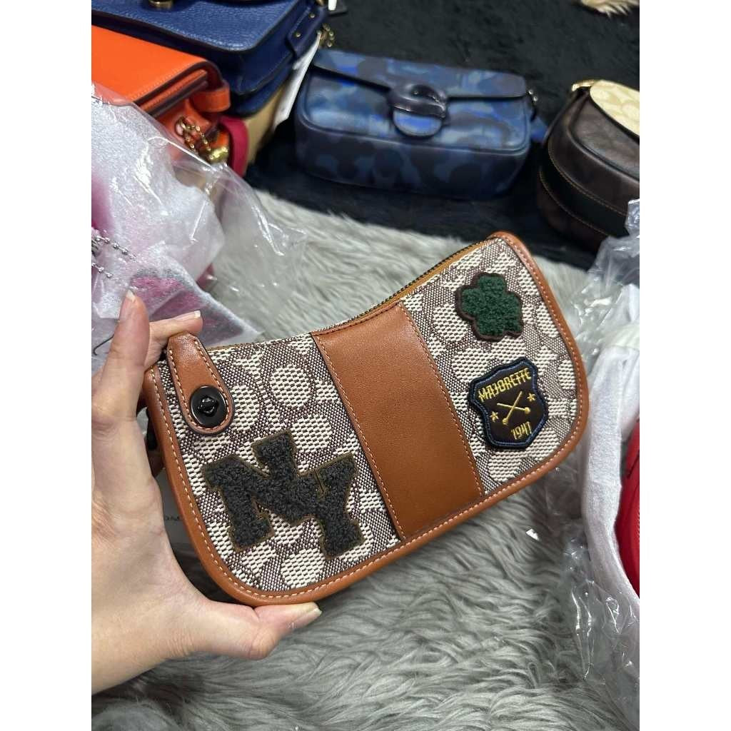 ORIG & IMPORTED CCH Retail Swinger 20 In Signature Jacquard With Varsity Patches Small Brown Bag