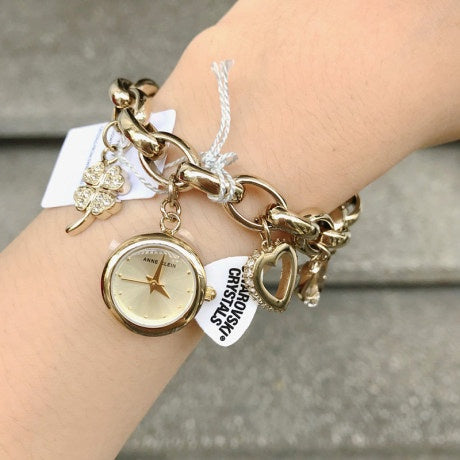 SALE! ❤️ Anne Klein Women's Premium Crystal Accented Gold-Tone Charm Bracelet Watch 10/7604CHRM