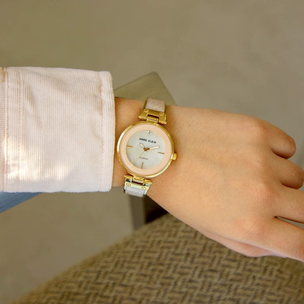 AUTHENTIC Anne Klein Women's AK/2512LPGB Diamond-Accented Gold-Tone and Blush Pink Marbleized Bangle Watch