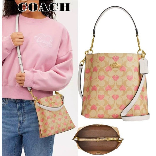 AUTHENTIC/ORIGINAL Preloved Coach Mollie Bucket Bag 22 In Signature Canvas With Heart Print Bag