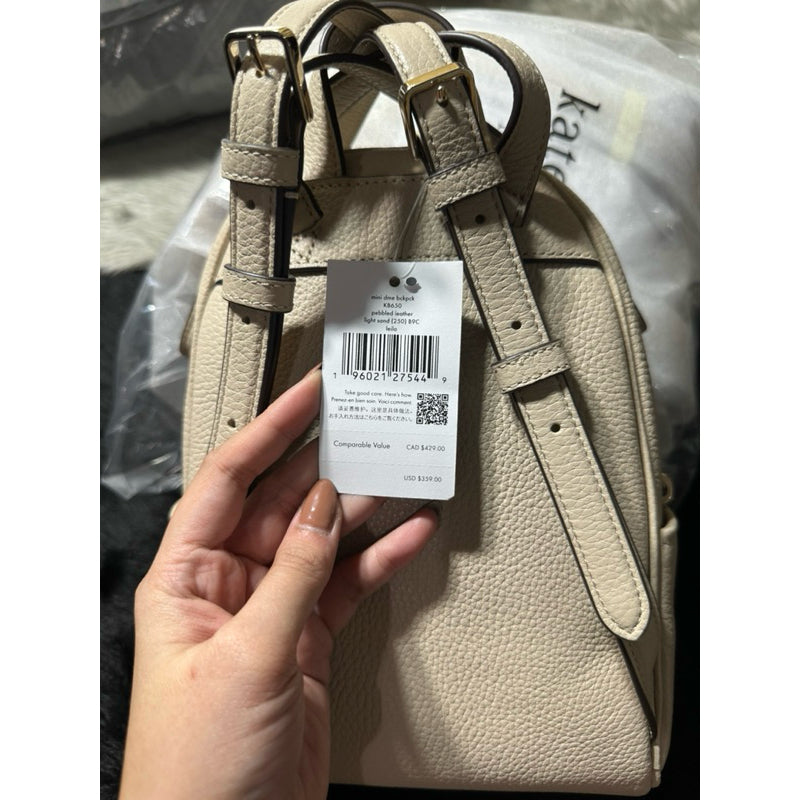 AUTHENTIC/ORIGINAL KateSpade Leila Pebbled Leather Mini Dome Backpack Bag in Light Sand/White